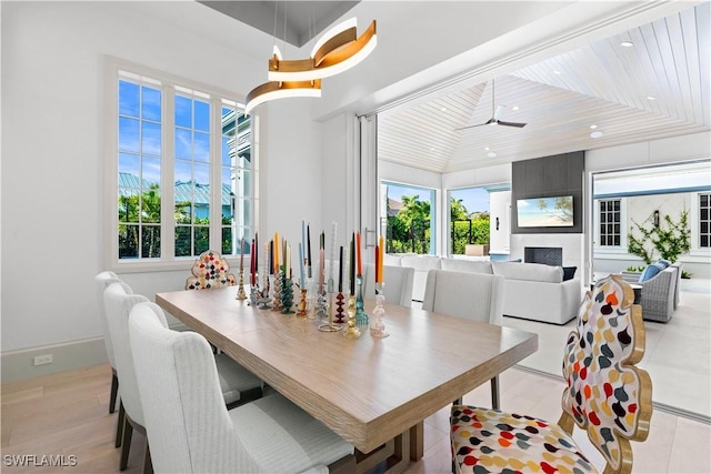 565 Anchor Rode Dr, Naples, FL 34103 - dining room with recessed lighting and a fireplace