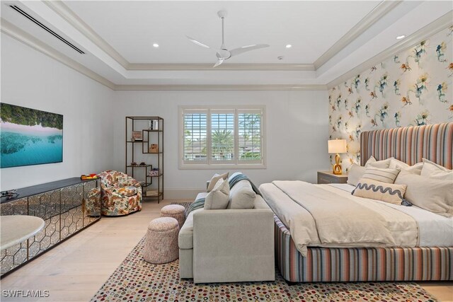 565 Anchor Rode Dr, Naples, FL 34103 - bedroom featuring ornamental molding, a tray ceiling, baseboards, and wood finished floors
