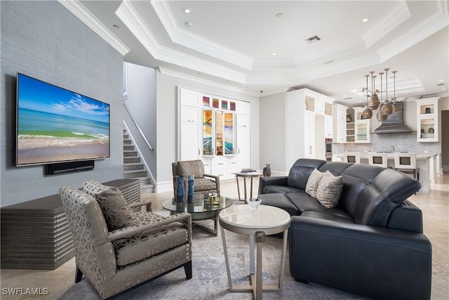 living room with visible vents, ornamental molding, a tray ceiling, recessed lighting, and stairs