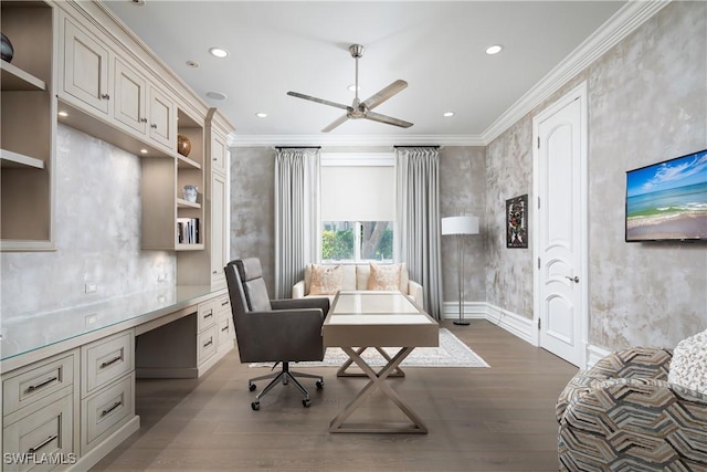 office area featuring hardwood / wood-style floors, crown molding, built in desk, and ceiling fan