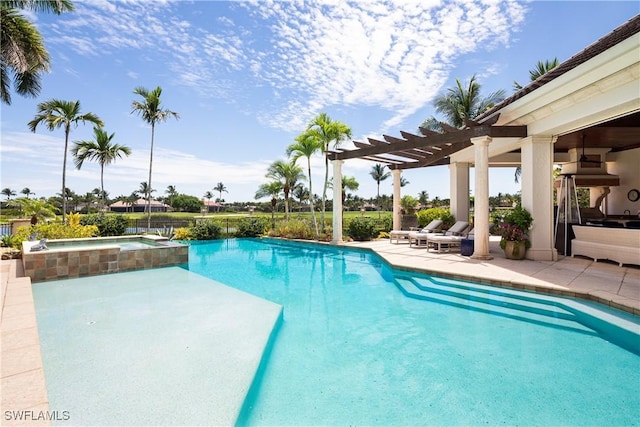 view of pool featuring a patio, a pergola, and a pool with connected hot tub