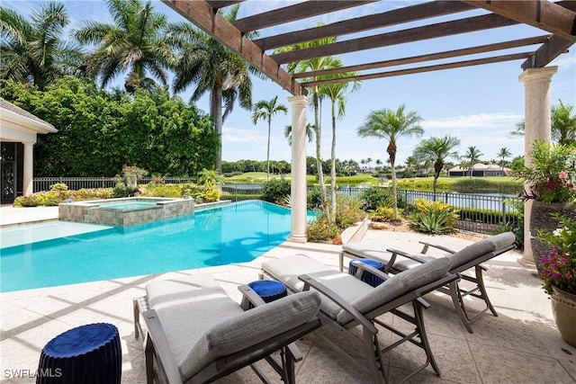 view of swimming pool with a pergola, a patio area, a water view, a pool with connected hot tub, and fence