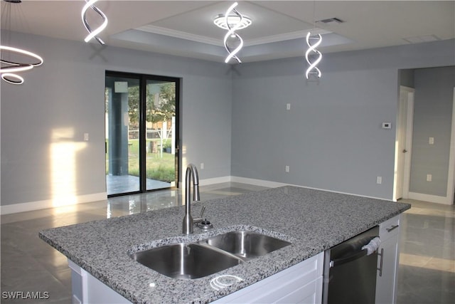 kitchen featuring sink, white cabinetry, hanging light fixtures, dishwasher, and light stone countertops