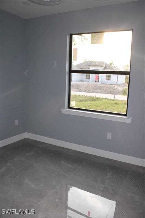 view of tiled spare room