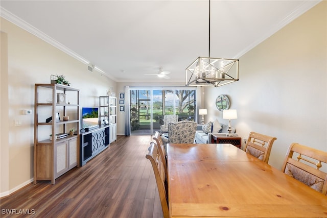 dining room featuring ornamental molding, dark hardwood / wood-style floors, and ceiling fan with notable chandelier