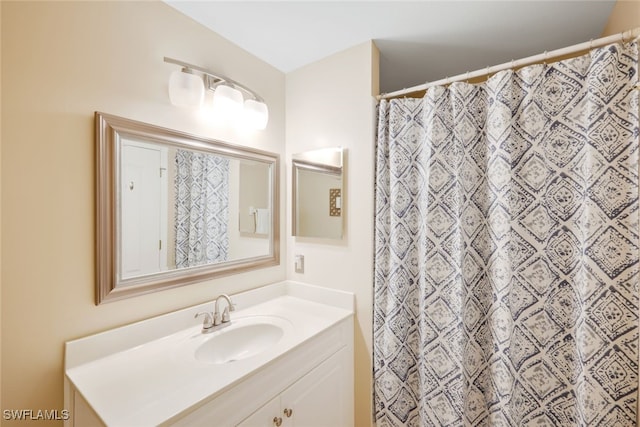 bathroom with vanity and a shower with shower curtain