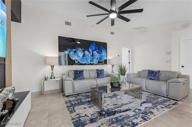 living room featuring ceiling fan and tile patterned flooring