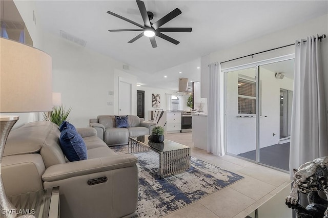 living room featuring light tile patterned floors and ceiling fan