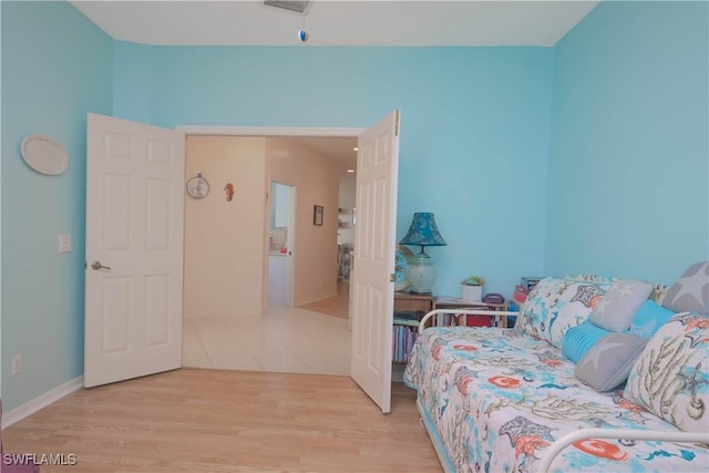 bedroom with wood finished floors