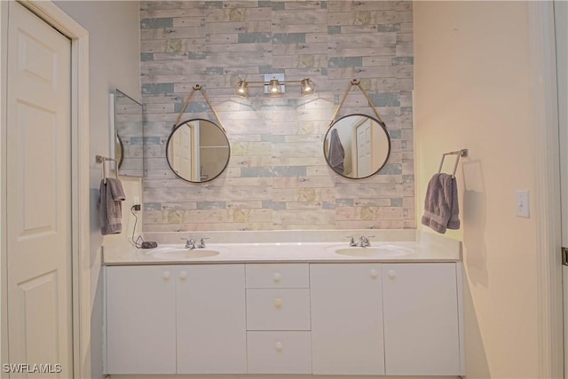 full bath with a sink and double vanity