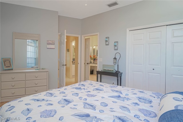 bedroom featuring a closet and visible vents