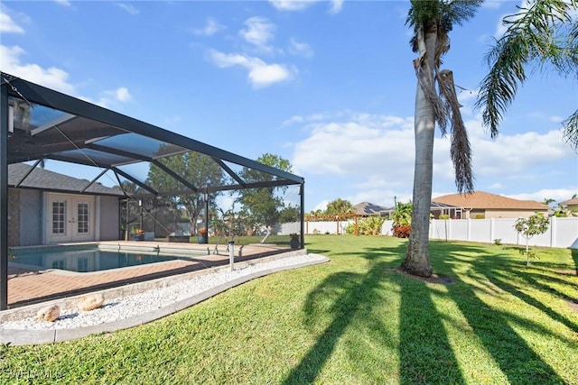 view of yard with a lanai and a fenced in pool