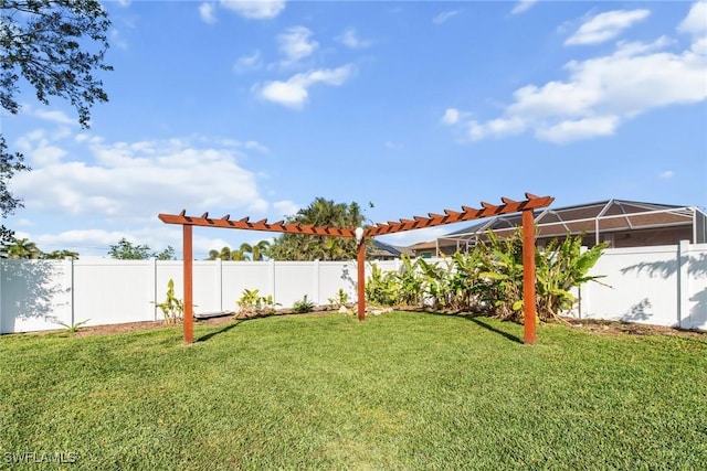 view of yard with a lanai