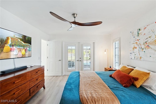 bedroom featuring french doors, ceiling fan, access to exterior, and light hardwood / wood-style floors