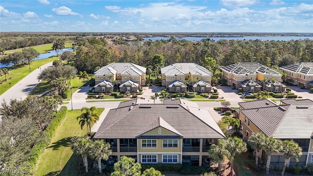 birds eye view of property with a water view