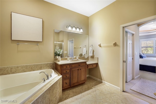 bathroom featuring vanity, shower with separate bathtub, and tile patterned flooring