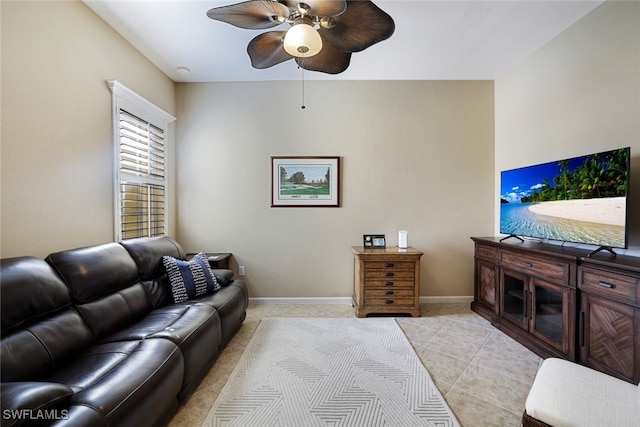 tiled living room with ceiling fan