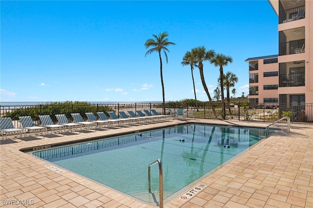 view of swimming pool featuring a patio area