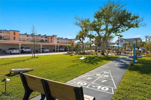 view of home's community with a lawn