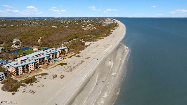 bird's eye view with a water view and a view of the beach