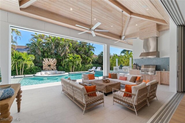 view of patio with ceiling fan, area for grilling, an outdoor living space, and grilling area