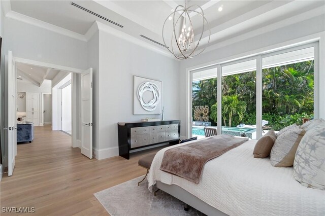 bedroom with crown molding, a notable chandelier, light hardwood / wood-style flooring, and access to outside