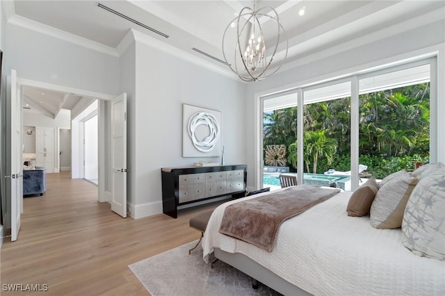 bedroom featuring baseboards, access to exterior, crown molding, light wood-type flooring, and a chandelier