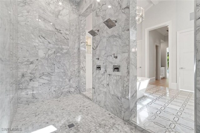 bathroom with tiled shower