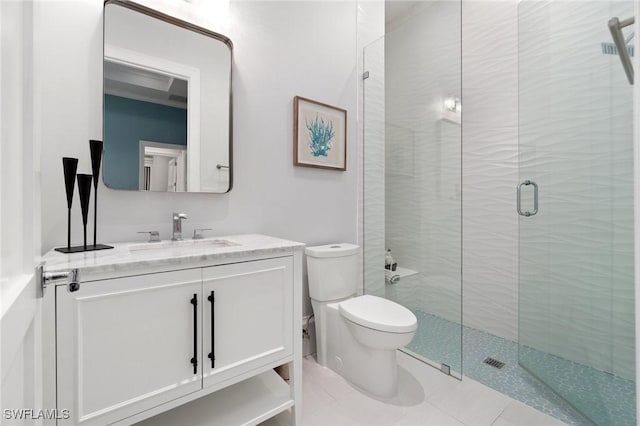 bathroom with a stall shower, tile patterned flooring, vanity, and toilet