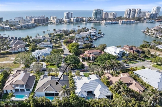 drone / aerial view with a water view and a city view