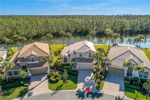 birds eye view of property with a water view