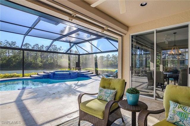 view of pool with an in ground hot tub, ceiling fan, a lanai, and a patio area