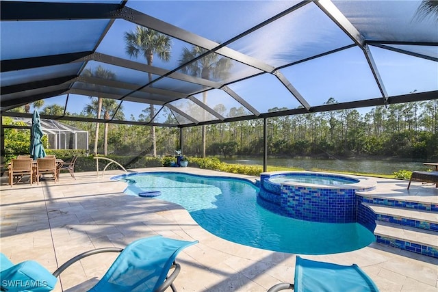 view of swimming pool with an in ground hot tub, a water view, a lanai, and a patio area