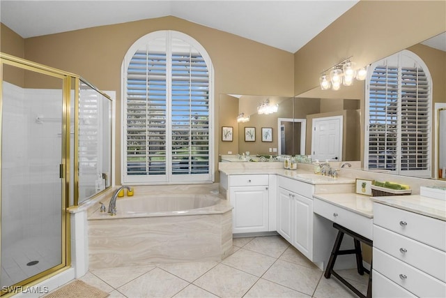 bathroom featuring tile patterned flooring, vanity, vaulted ceiling, and plus walk in shower