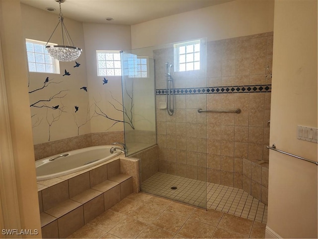 bathroom with tile patterned floors, tiled shower, and a garden tub