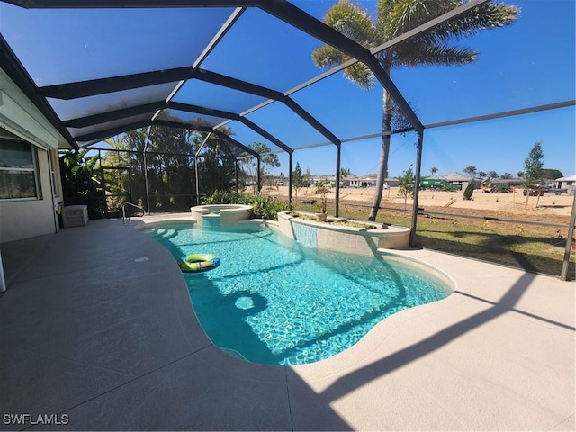 view of pool with glass enclosure, a patio, and a pool with connected hot tub