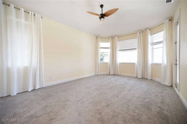 10347 Wood Ibis Ave, Bonita Springs, FL 34135 - spare room featuring visible vents, baseboards, a ceiling fan, and carpet floors