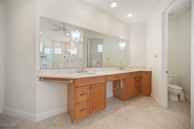 10347 Wood Ibis Ave, Bonita Springs, FL 34135 - full bathroom featuring double vanity, a walk in shower, baseboards, and a sink