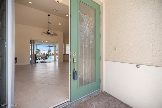 10347 Wood Ibis Ave, Bonita Springs, FL 34135 - property entrance with a ceiling fan and visible vents