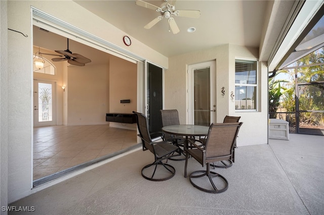 10347 Wood Ibis Ave, Bonita Springs, FL 34135 - view of patio / terrace with glass enclosure, ceiling fan, and outdoor dining space
