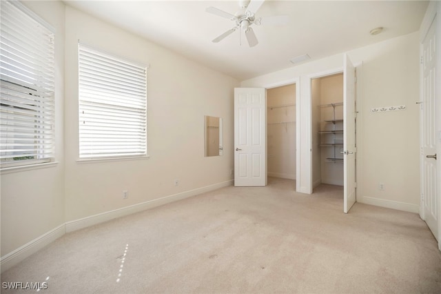 10347 Wood Ibis Ave, Bonita Springs, FL 34135 - unfurnished bedroom with baseboards, light carpet, and ceiling fan