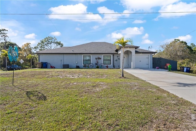 single story home featuring a garage and a front lawn