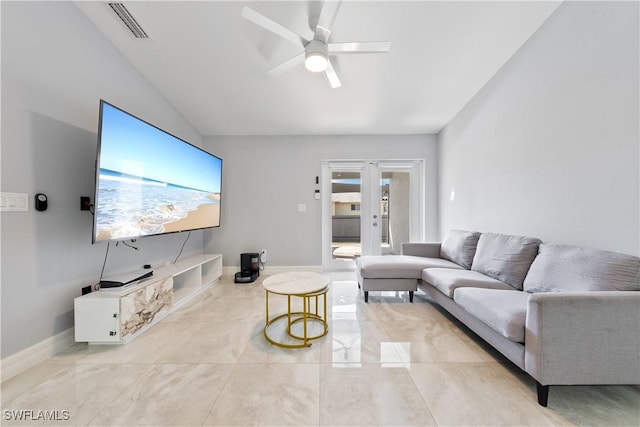 living room featuring vaulted ceiling, french doors, and ceiling fan