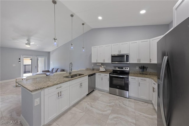 kitchen featuring appliances with stainless steel finishes, pendant lighting, sink, white cabinets, and kitchen peninsula