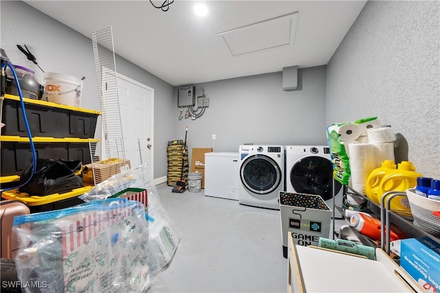 laundry area with washing machine and dryer