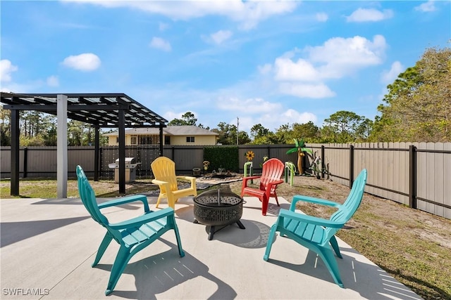 view of patio with a pergola and an outdoor fire pit