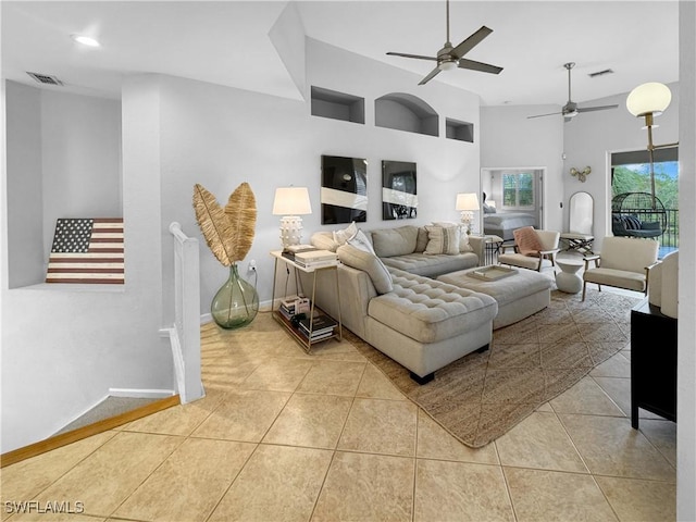 living room with ceiling fan and light tile patterned floors