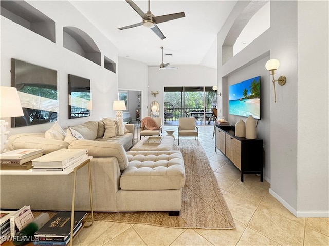 tiled living room featuring a towering ceiling and ceiling fan