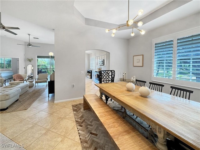 tiled dining space with an inviting chandelier