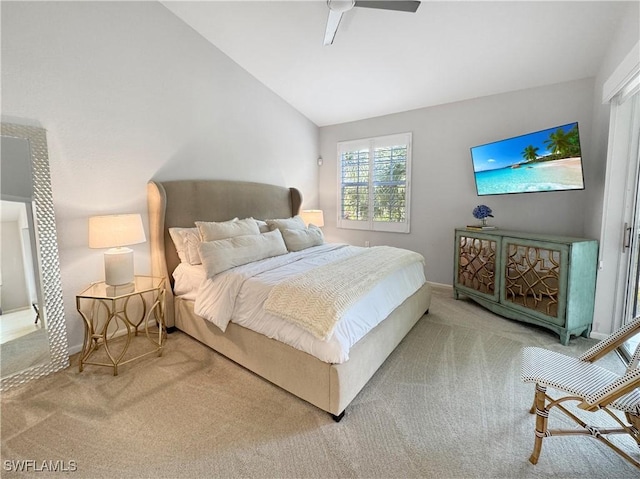 bedroom featuring ceiling fan, lofted ceiling, and carpet floors